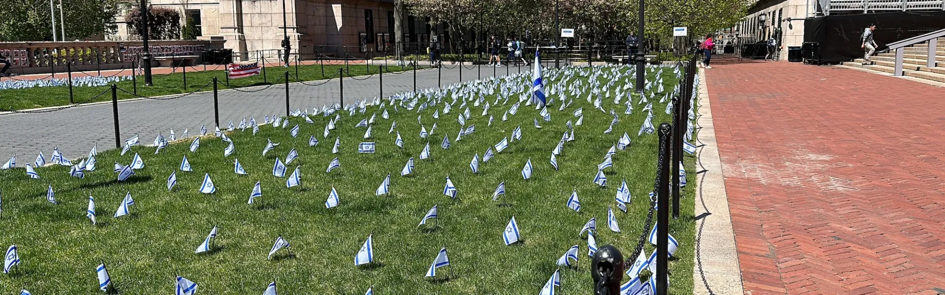Small Israeli flags planted on a Columbia University campus lawn